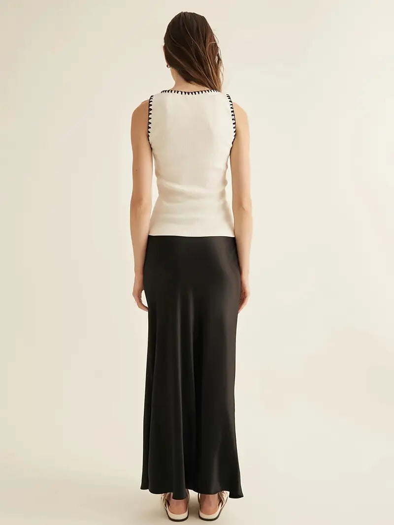 Sleeveless White Knit Top with Black Contrast Trim